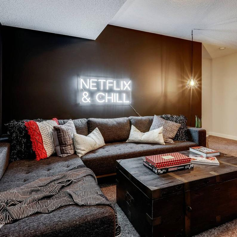 netflix and chill neon sign - How to style your apartment into a renter-friendly one